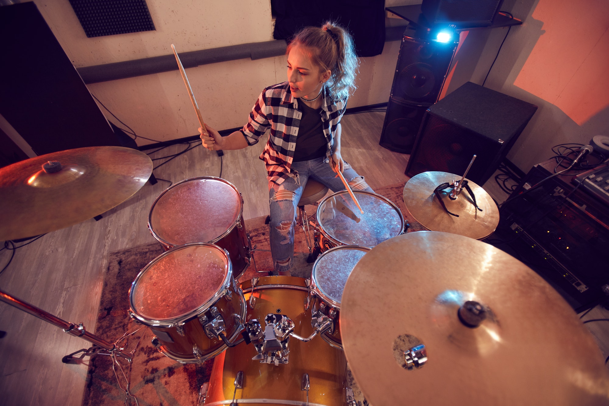 Young Woman Rocking Drums